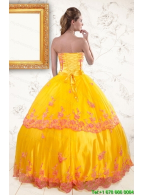 2015 Exquisite Strapless Gold Quinceanera Dresses with Appliques