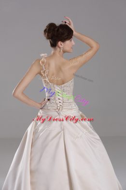 Customized Champagne Satin Lace Up One Shoulder Sleeveless Vestidos de Quinceanera Brush Train Embroidery and Hand Made Flower