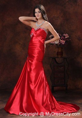 A-line Red Sweetheart Ruching Celebrity Dress With Brush Train Beading