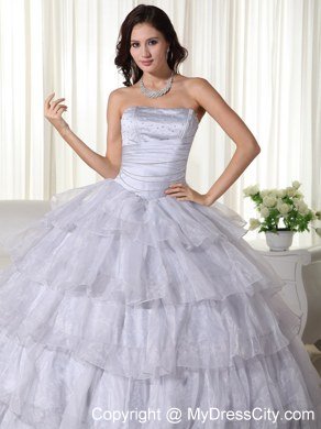 Strapless Organza Ruched Grey Quninceanera Gowns With Ruffled Layers