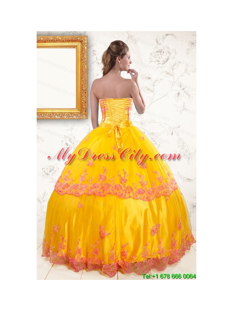 2015 Exquisite Strapless Gold Quinceanera Dresses with Appliques