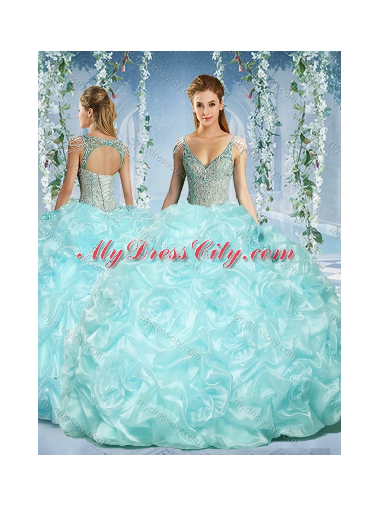 Gorgeous Cap Sleeves Beaded Light Blue Quinceanera Dress with Deep V Neck