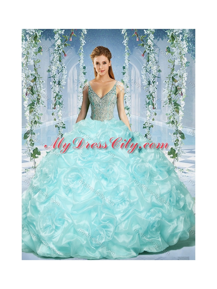 Gorgeous Cap Sleeves Beaded Light Blue Quinceanera Dress with Deep V Neck