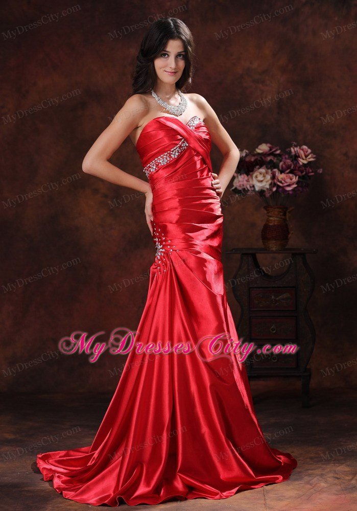 A-line Red Sweetheart Ruching Celebrity Dress With Brush Train Beading