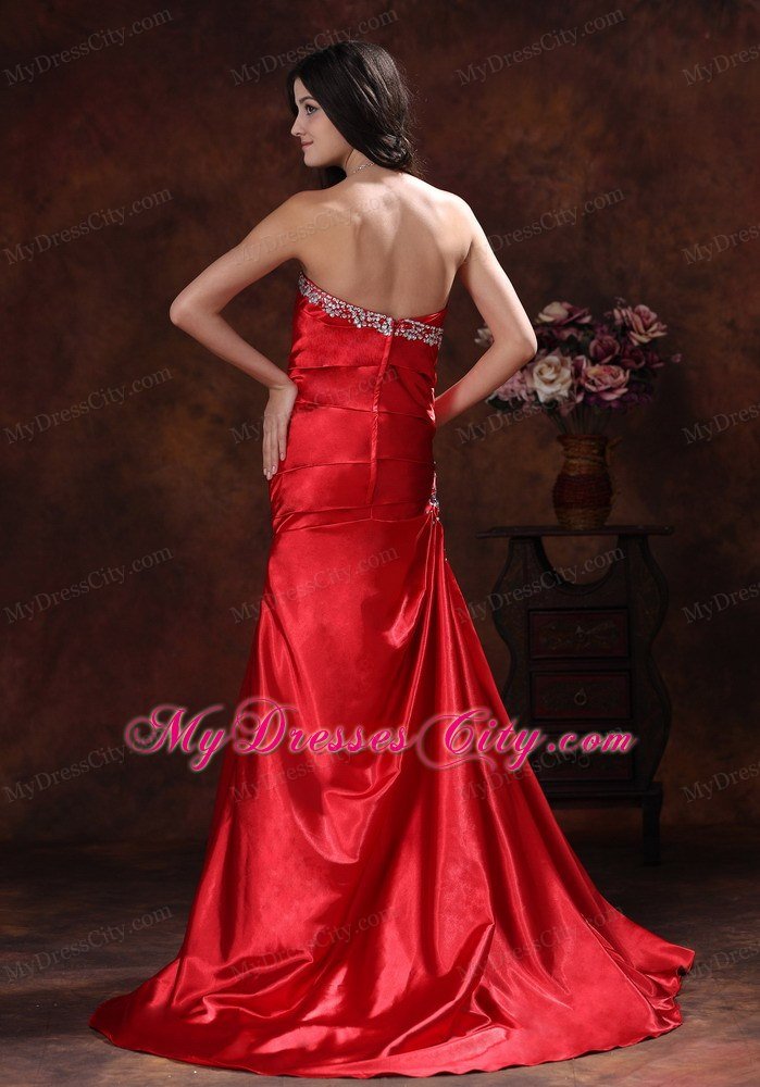 A-line Red Sweetheart Ruching Celebrity Dress With Brush Train Beading