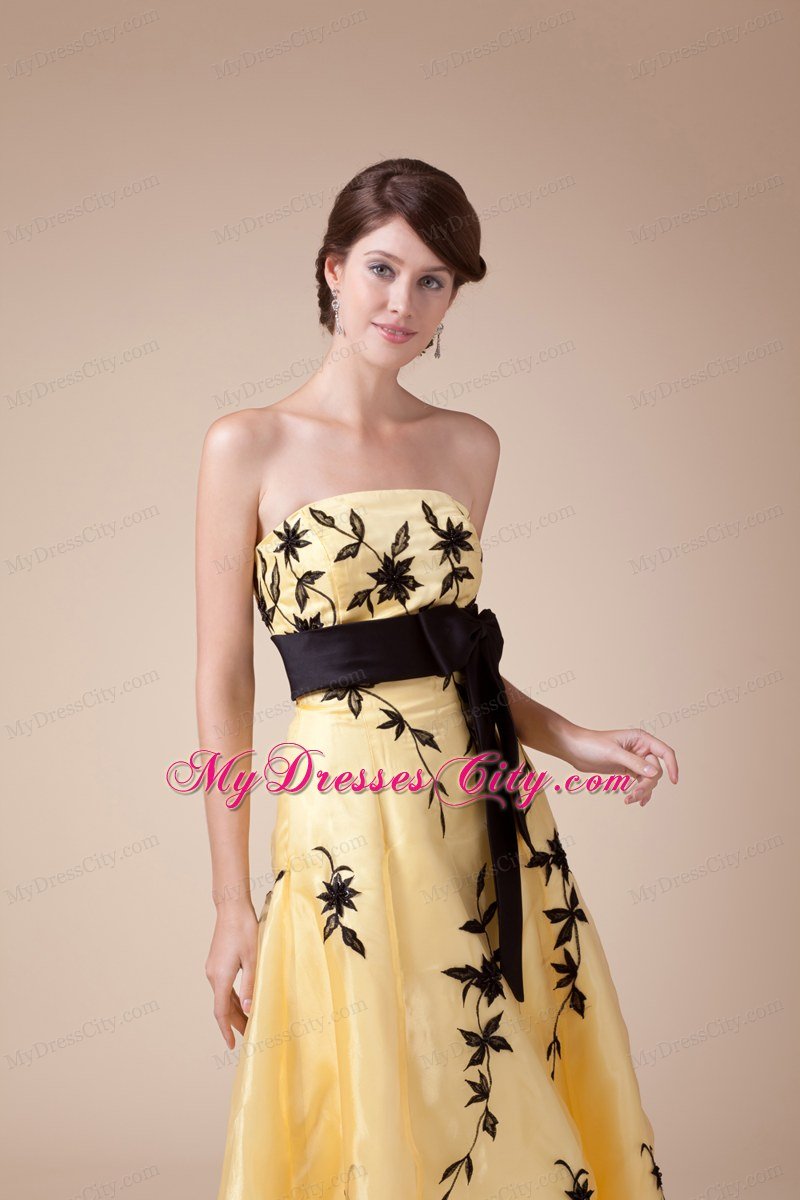 Exclusive Strapless Embroidery Yellow Prom Gown with Black Bowknot