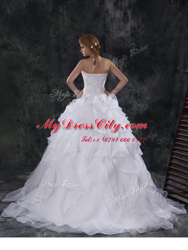 Extravagant Organza Sleeveless With Train Wedding Gowns Brush Train and Beading and Appliques and Ruffles